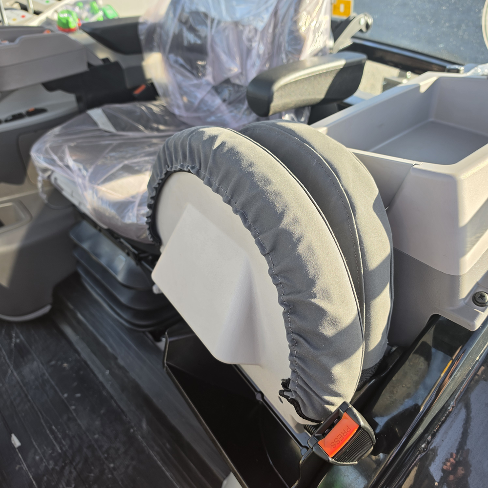 WORKPROOF heavy-duty canvas seat cover on folded Deutz Dickie tractor seat, showing durable construction and secure fit for hard-working agricultural use