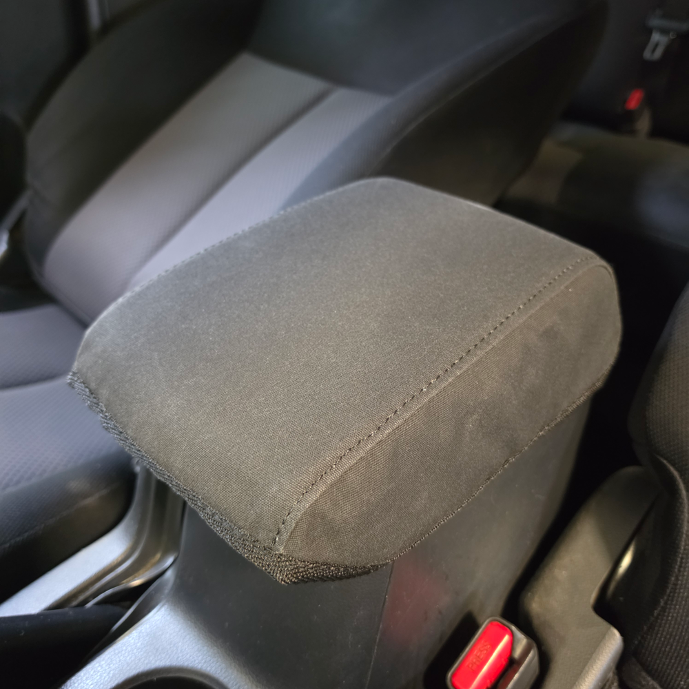 Mitsubishi Triton 2014–2024 centre console fitted with a custom-made Workproof black canvas cover for durable protection against everyday wear and tear.