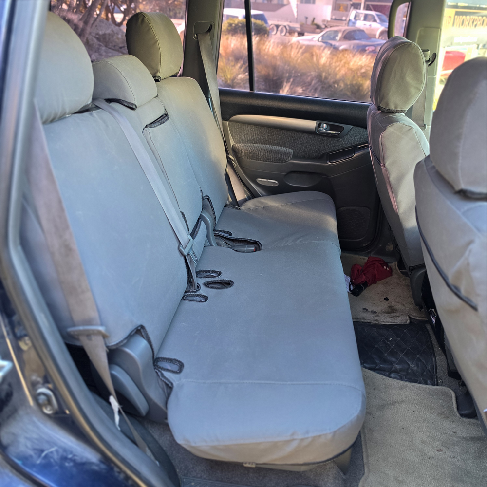 Toyota Land Cruiser Prado 2003–2009 charcoal canvas rear seat covers, custom-fit Workproof canvas seat covers made in New Zealand.