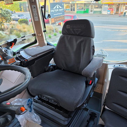 Black WorkProof canvas seat cover fitted to a Grammer MAXIMO XT Evolution MSG97EL/741 tractor seat, offering heavy-duty protection against dirt, wear, and harsh farming conditions.