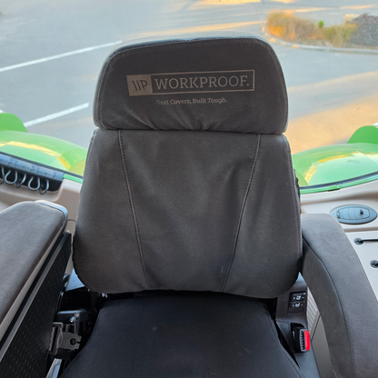 Front view of a Grammer MAXIMO XT Evolution MSG97EL/741 tractor seat fitted with a black WorkProof heavy-duty canvas seat cover, providing durable protection and a factory-style fit for agricultural machinery.