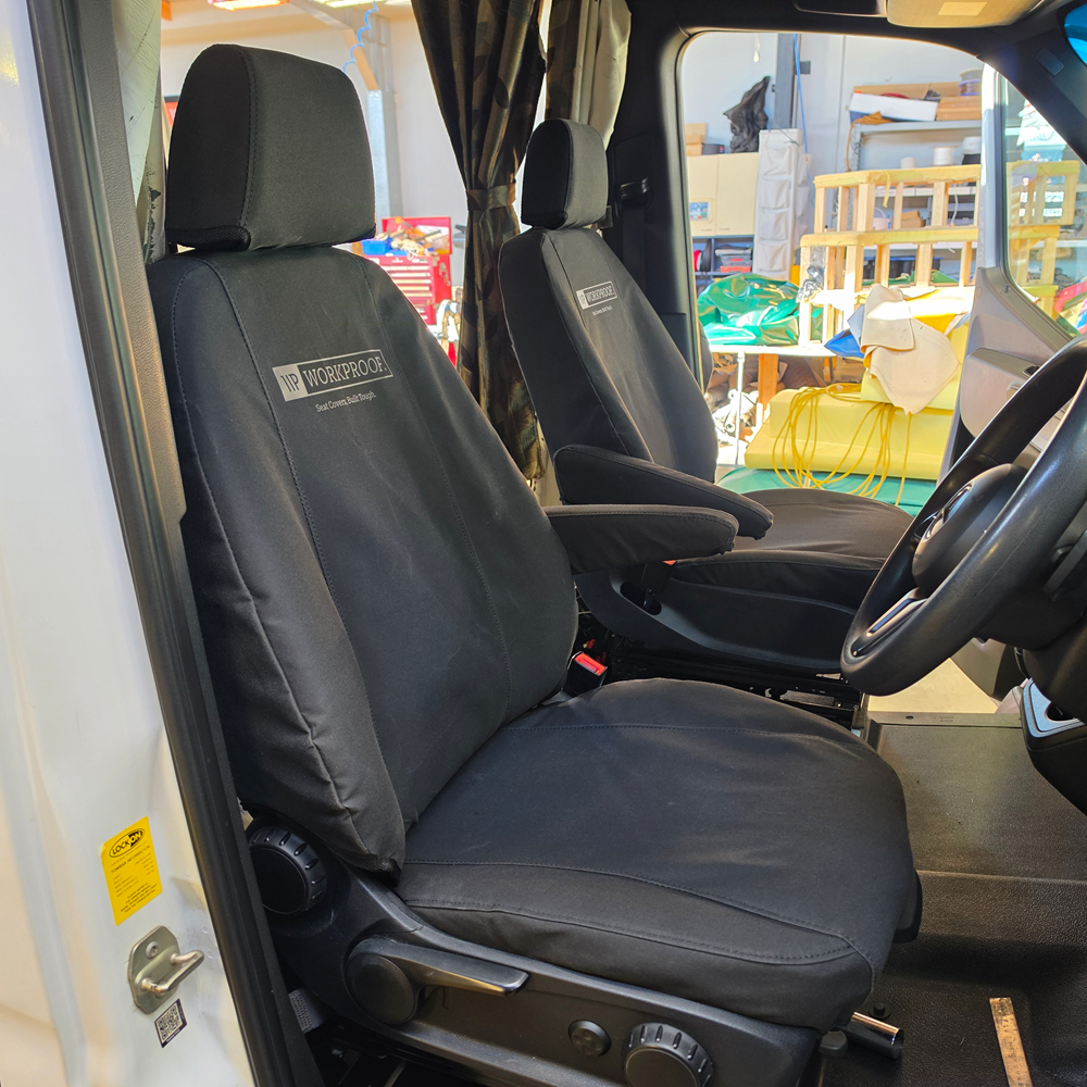 Driver's seat of a Mercedes-Benz Sprinter 2018+ van fitted with a black WorkProof heavy-duty canvas seat cover, designed to protect against daily wear, dirt, and spills while maintaining a factory-style fit.