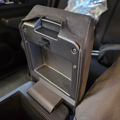 Mitsubishi Triton 2024 center console cover in heavy-duty black canvas with the console lid open, showing a custom-fitted design that protects against wear, dirt, and everyday use.