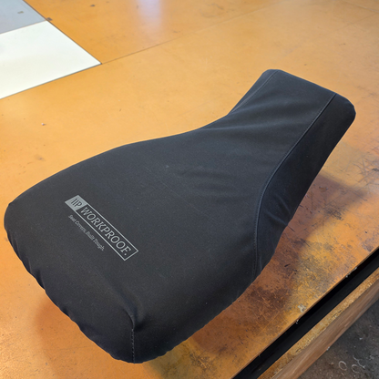 Black Workproof 12oz canvas seat cover fitted to a Polaris Sportsman 450/570 ATV, providing a snug fit and heavy-duty protection from mud, water, UV damage, and daily wear.