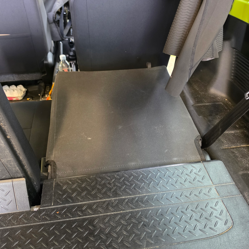 Suzuki Jimny 3 Door rear seat covers folded forward in black heavy-duty waterproof canvas showing full seat protection and factory-style fit