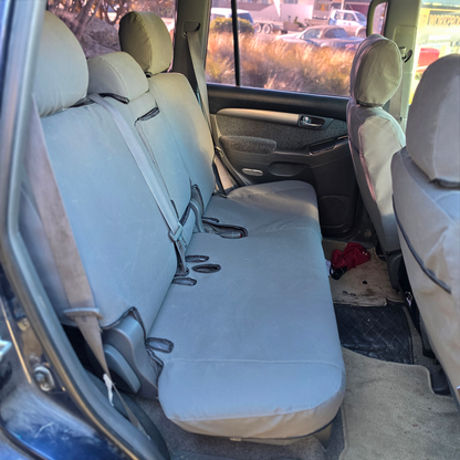Toyota Land Cruiser Prado 2003–2009 charcoal canvas rear seat covers, custom-fit Workproof canvas seat covers made in New Zealand.