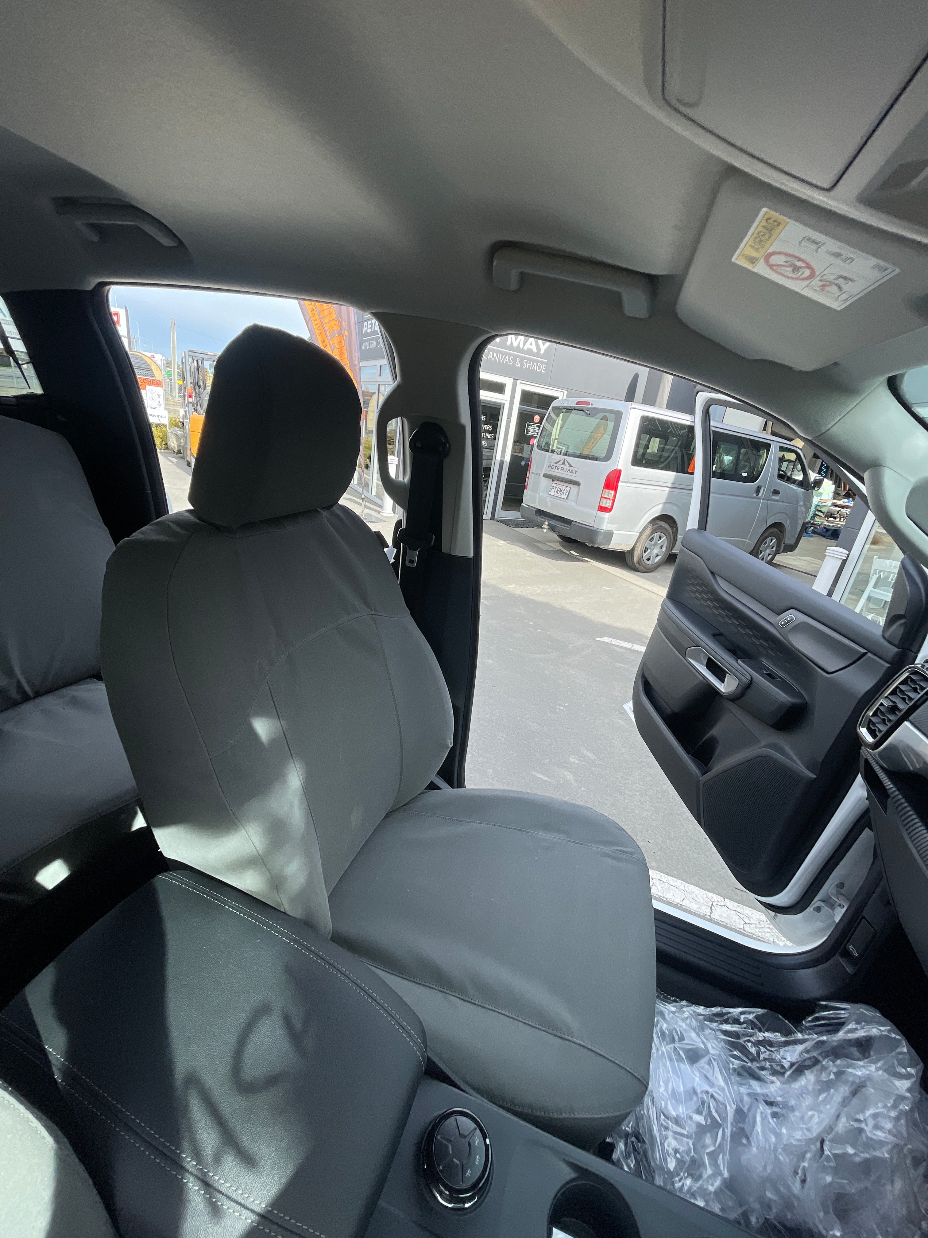 Front seat view of grey WORKPROOF heavy-duty canvas seat covers fitted to Ford Ranger with waterproof protection and durable factory-style fit.